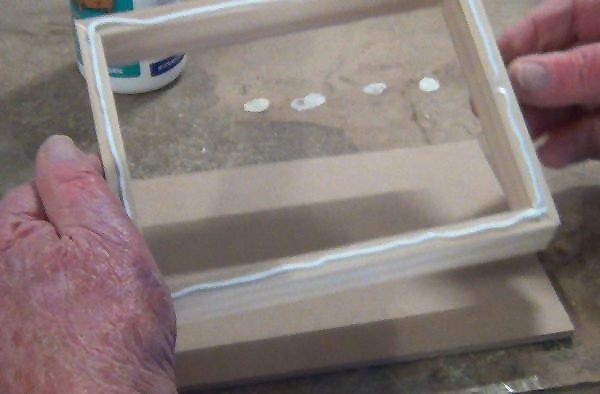 Box frame sides with bead of glue added