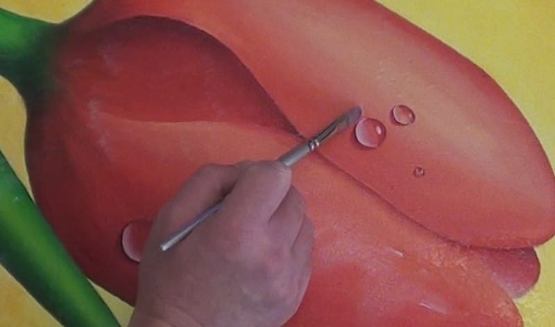 Close up view showing how to gently brush over impasto areas to avoid damage