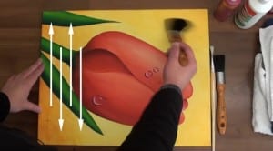 Painting being brushed in a vertical direction