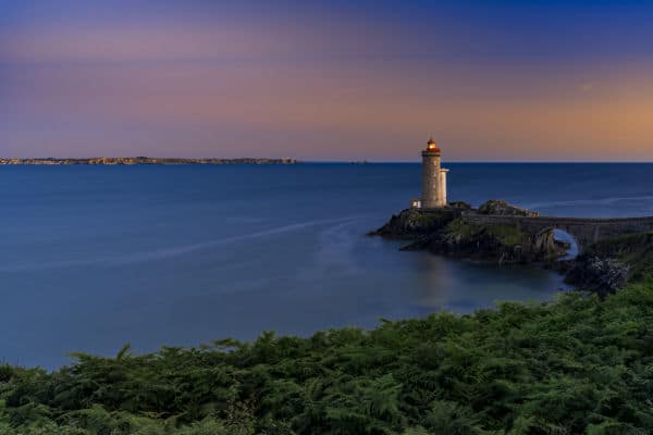 photo of seascape during sunset